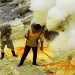 Workers extracting critical minerals in dangerous, toxic conditions without protection.