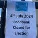 Sign attached to railings outside a church, which reads: Hornsey Food Bank - 4th July 2024 foodbank closed for election.