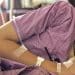 South Asian woman in bed with ME/CFS