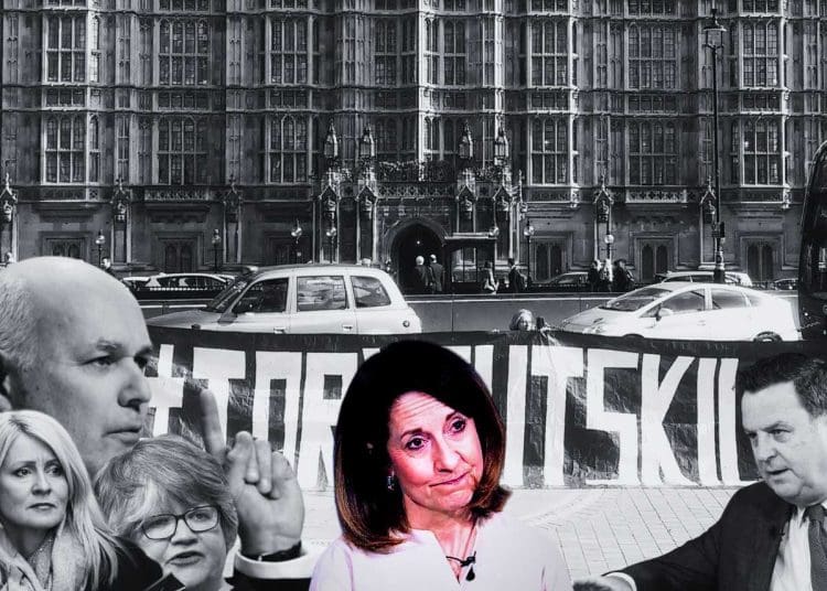 Disabled people a picture of former DWP ministers and Liz Kendall against a banner that reads 'tory cuts kill' outside parliament