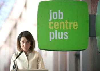 Liz Kendall with a job centre plus sign behind her DWP PIP benefits