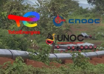 EACOP project mid-construction through jungle. TotalEnergies, CNOOC, and UNOC logos.