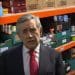 Former Labour leader Gordon Brown with foodbank shelves behind him Guardian