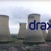 Drax power station pouring out pollution, with the Drax logo.