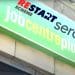 Jobcentre Plus sign over the entrance to a building, with Serco and the Restart Scheme logo superimposed on top DWP