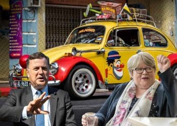 Coffey and Stride with a clown car behind them