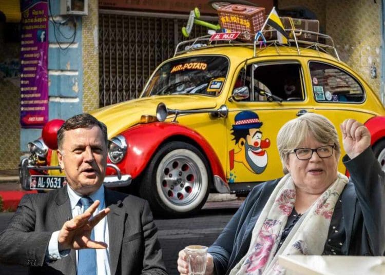 Coffey and Stride with a clown car behind them
