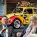 Coffey and Stride with a clown car behind them