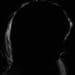 ME/CFS the shadow of a woman's face in a dark room