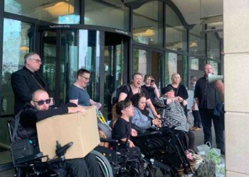 Disabled people protesting outside Portcullis House over the DWP