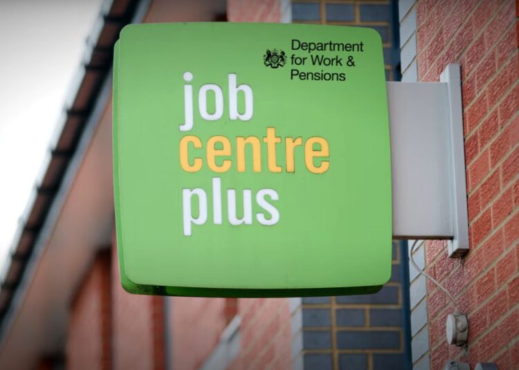 Jobcentre plus sign affixed to a building, with the DWP logo superimposed over it DWP sanctions Universal Credit