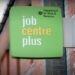 Jobcentre plus sign affixed to a building, with the DWP logo superimposed over it DWP sanctions Universal Credit