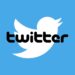 Twitter bird logo in blue and white, and text logo in black.