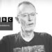 Thomas Hand speaking, in grayscale. The BBC Panorama logos Israel