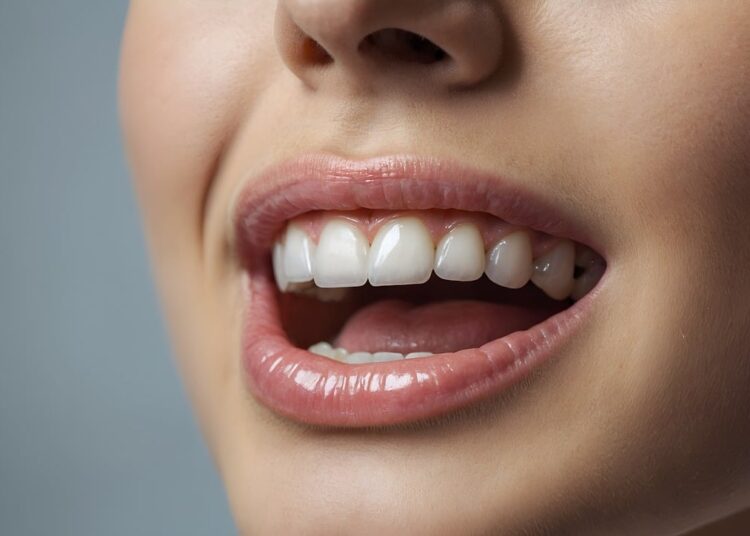 A photo of a woman's open mouth showing her perfect teeth