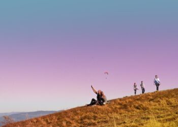 people walking on a hill during a walking holiday