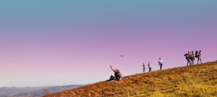 people walking on a hill during a walking holiday