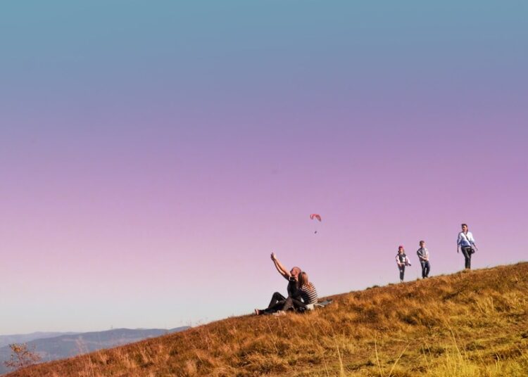 people walking on a hill during a walking holiday