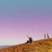 people walking on a hill during a walking holiday