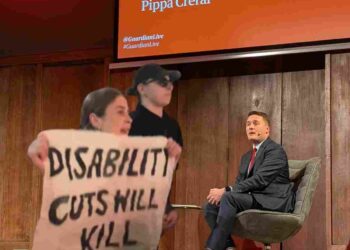 Wes Streeting faced protests over both DWP PIP cuts and NHs privatisation at a Guardian Live event at Conway Hall