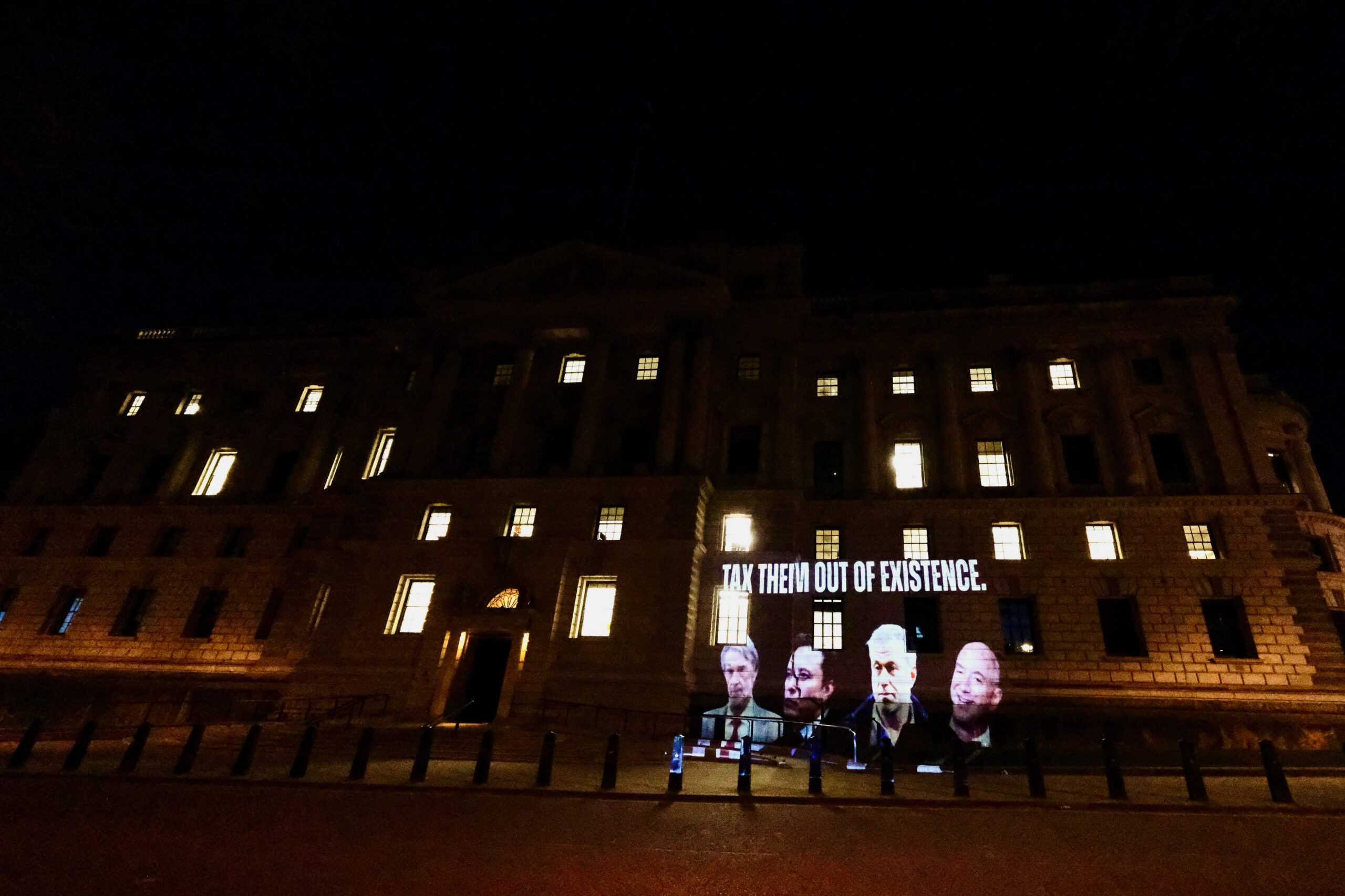 Elon Musk, Jeff Bezos, Roman Abramovich, and Jim Ratcliffe on the walls of the Treasury with the words: "Tax them out of existence."