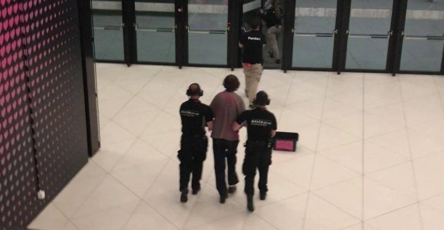 Security removing Youth Demand supporter. 