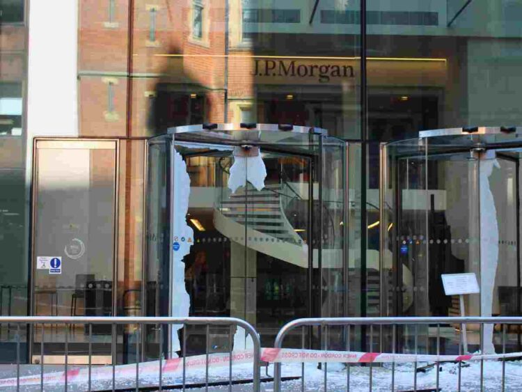 JP Morgan front doors completely shattered with glass everywhere by Palestine Action
