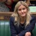 Kim Leadbeater shaking her head on the benches in the House of Commons during a debate on the assisted suicide bill.