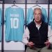 Nigel Farage in front of Reform FC shirts