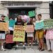 Protesters standing with Mr Monopoly outside Henley and Partners, holding placards reading: "Capital flight? Load of Sh*te", "Henley & Partners - Architects of capital flight myth", "Thanks for fudging the numbers", "Bogus millionaire exodus", "H&P loves Caribbean election meddling", "Democracy for sale", and "Cambridge Analytica manipulated voters. Henley & Partners manipulated the data."