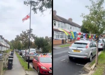 A street in Croydon with a big St. George's cross and smaller flags for all the other countries of the world