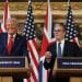 Donald Trump smiling and Keir Starmer standing next to him
