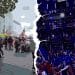Right-wing protesters at Unite the Kingdom in London with numerous Union Jack flags on the streets of London to the left, a sea of EU flags at Last Night at the Proms on the right with a white crack down the middle.