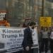 People protesting Jimmy Kimmel's axing, with a banner that reads: "Kimmel stays, Trump must go!"