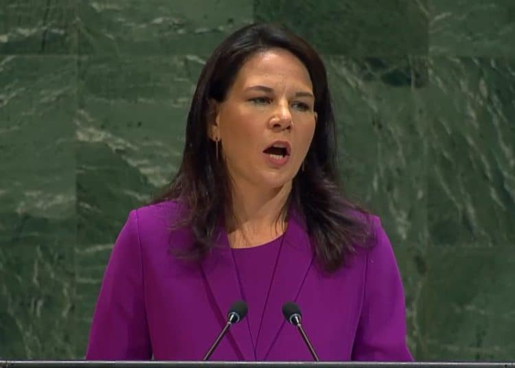 UN president Annalena Baerbock speaking at the podium on Gaza