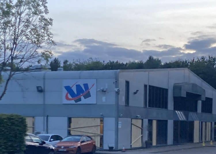 Walker Precision Engineering with boarded up windows after an action targeting the manufacturer.