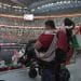 A fan in a wheelchair in the disabled people's viewing area at the Arab Cup