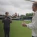 Lewis Moody passes a rugby ball to a boy called Jake who lives with a stoma