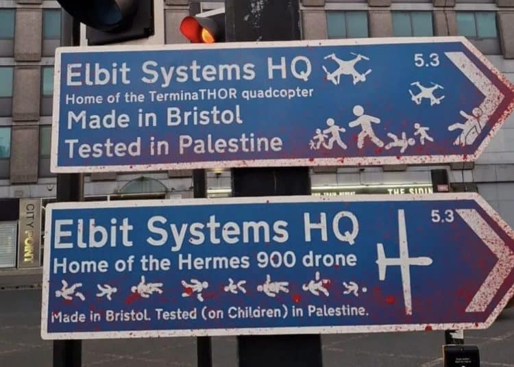 Spoof road signs pointing to Elbit Systems HQ, saying Made in Bristol Tested in Palestine