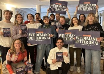 Equity members holding signs saying We Demand Better On AI