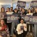 Equity members holding signs saying We Demand Better On AI
