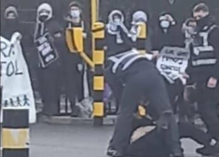 Actionist dragged away by security at Elbit Systems factory in Filton