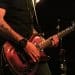 Close up of a person playing electric guitar