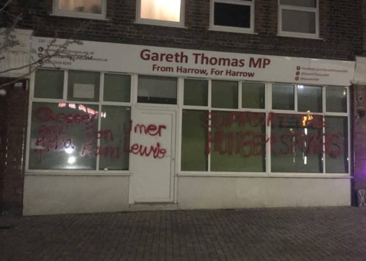 Painted messages of support for hunger strikers on office of Harrow MP Gareth Thomas