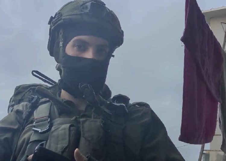 Israeli occupation forces soldier demanding entry into a home in the West Bank
