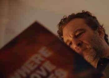 A man holds a record sleeve saying Where Love Lives in John Lewis Christmas advert