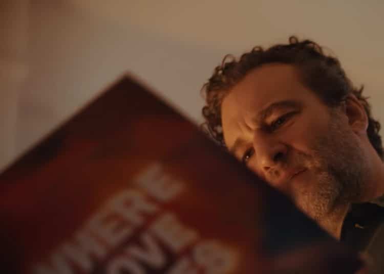 A man holds a record sleeve saying Where Love Lives in John Lewis Christmas advert