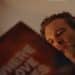 A man holds a record sleeve saying Where Love Lives in John Lewis Christmas advert