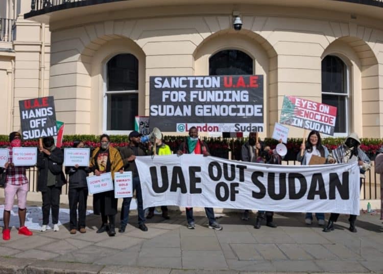 London for Sudan protestors outside the UAE embassy hold a banner saying UAE Out Of Sudan