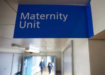 Blue sign saying Maternity Unit in a hospital corridor